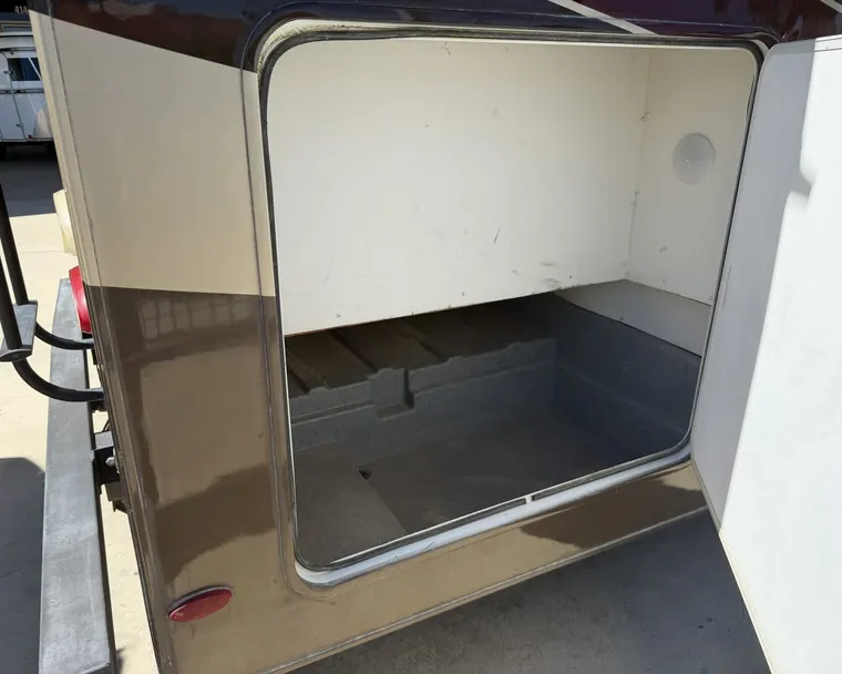 An open basement storage bay on a 2017 Forest River Forester 3051S Class C motorhome