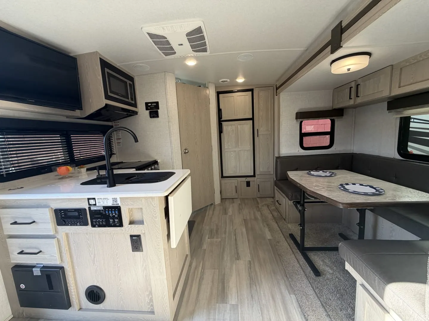 Galley and dinette inside a 2021 Forest River Rockwood Mini Lite 2104S travel trailer