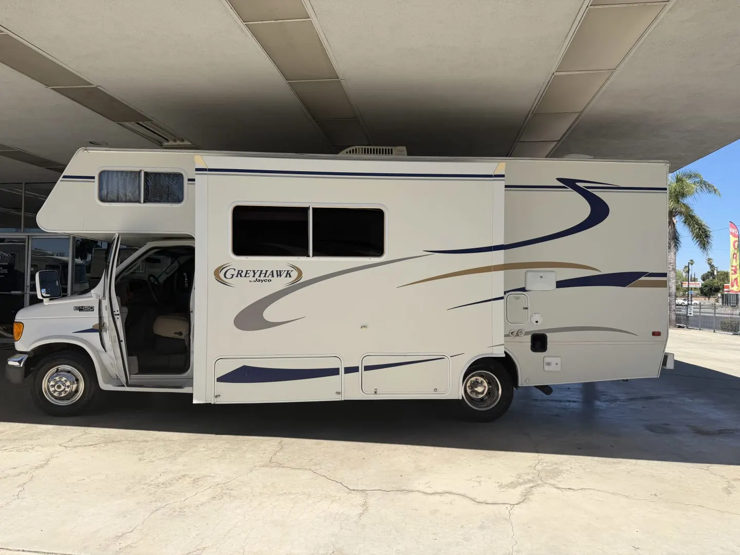 2004 Jayco Greyhawk 26SS Class C motorhome with its slide out, side view